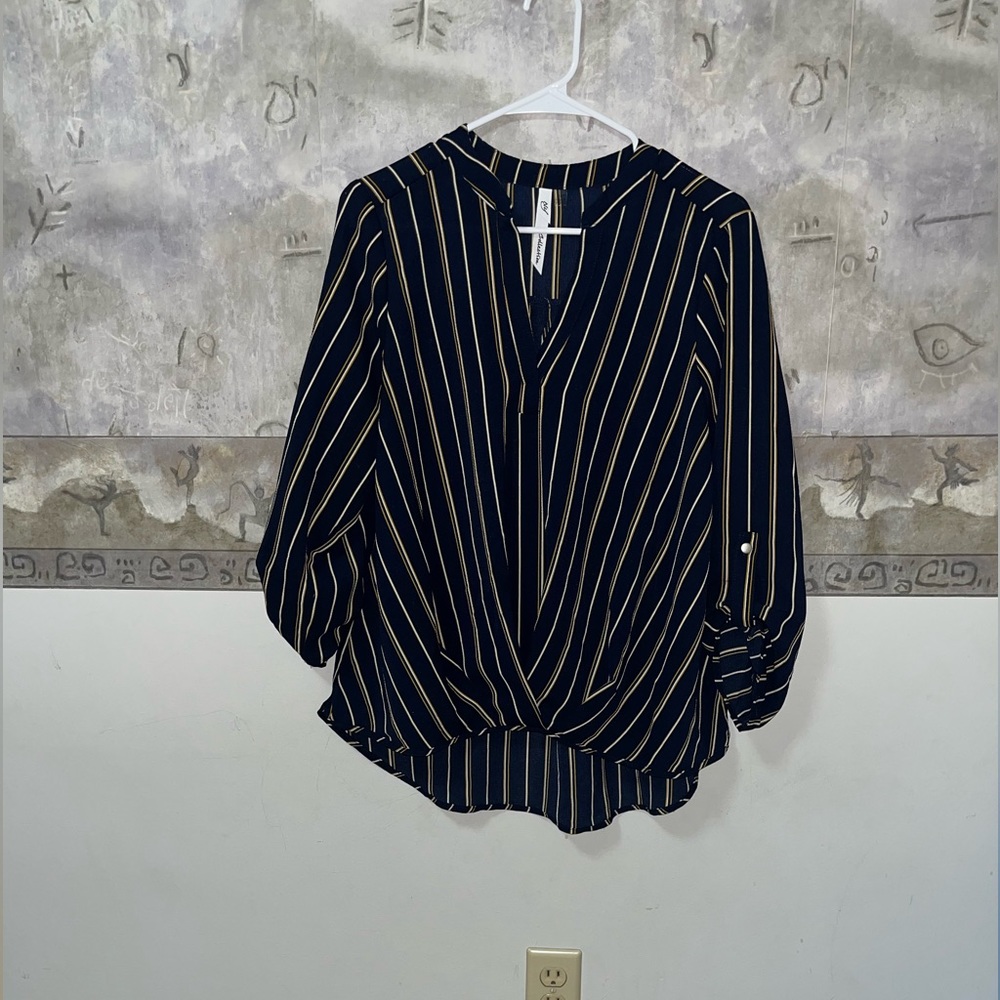 Women’s Brand new blouse. Cuffed quarter sleeve. Sheer material. Lightweight.